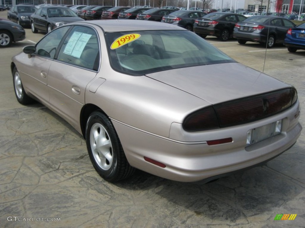 Champagne Metallic 1999 Oldsmobile Aurora Standard Aurora Model Exterior Photo #79475720