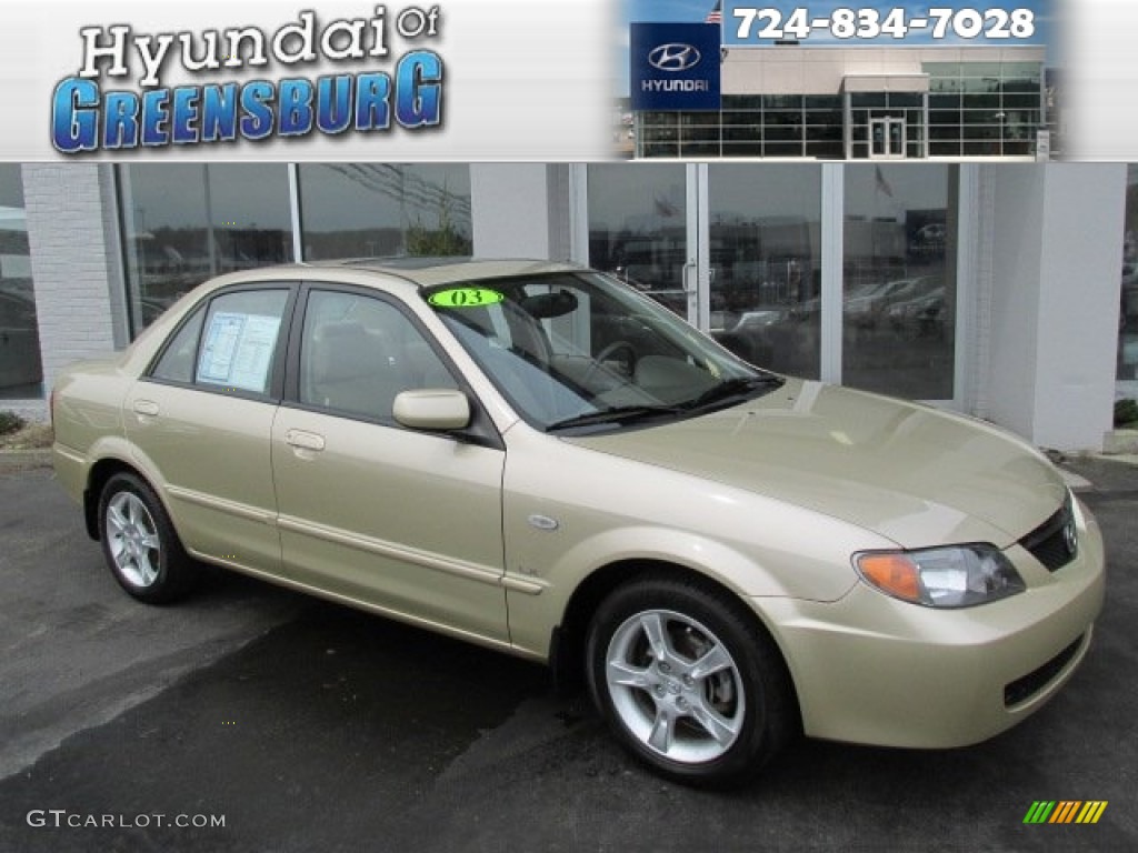 Light Sandalwood Metallic Mazda Protege