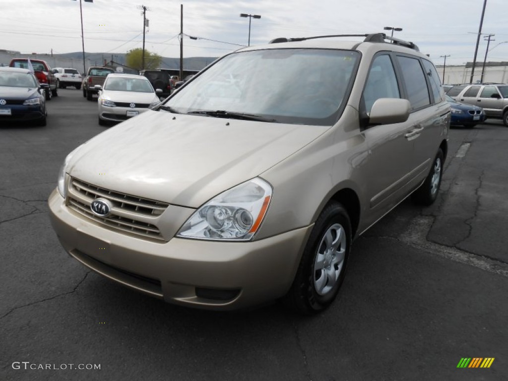 Sunset Gold Metallic Kia Sedona