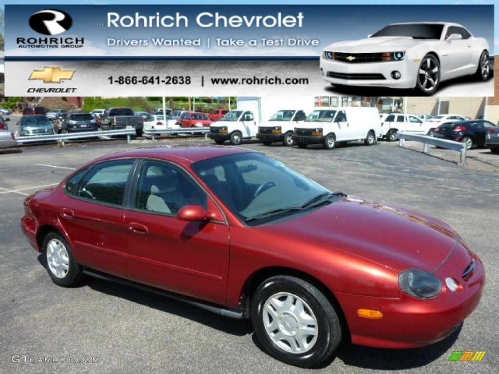 1999 Taurus SE - Toreador Red Metallic / Medium Graphite photo #1