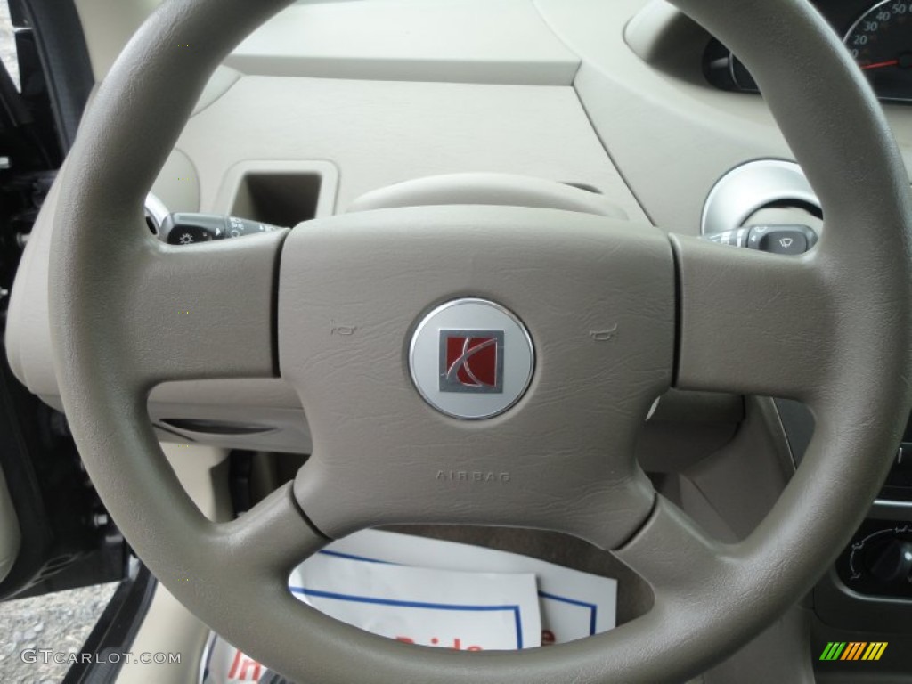 2007 Saturn ION 2 Sedan Tan Steering Wheel Photo #80448449
