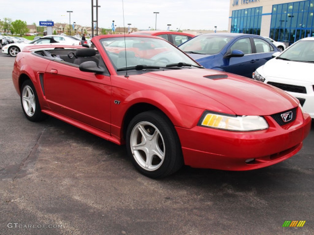 Laser Red Metallic 2000 Ford Mustang GT Convertible Exterior Photo #80767926
