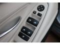 Oyster/Black Controls Photo for 2011 BMW 5 Series #80771568