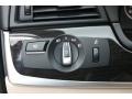 Oyster/Black Controls Photo for 2011 BMW 5 Series #80771745