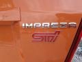 2013 Subaru Impreza WRX STi 4 Door Orange Special Edition Badge and Logo Photo
