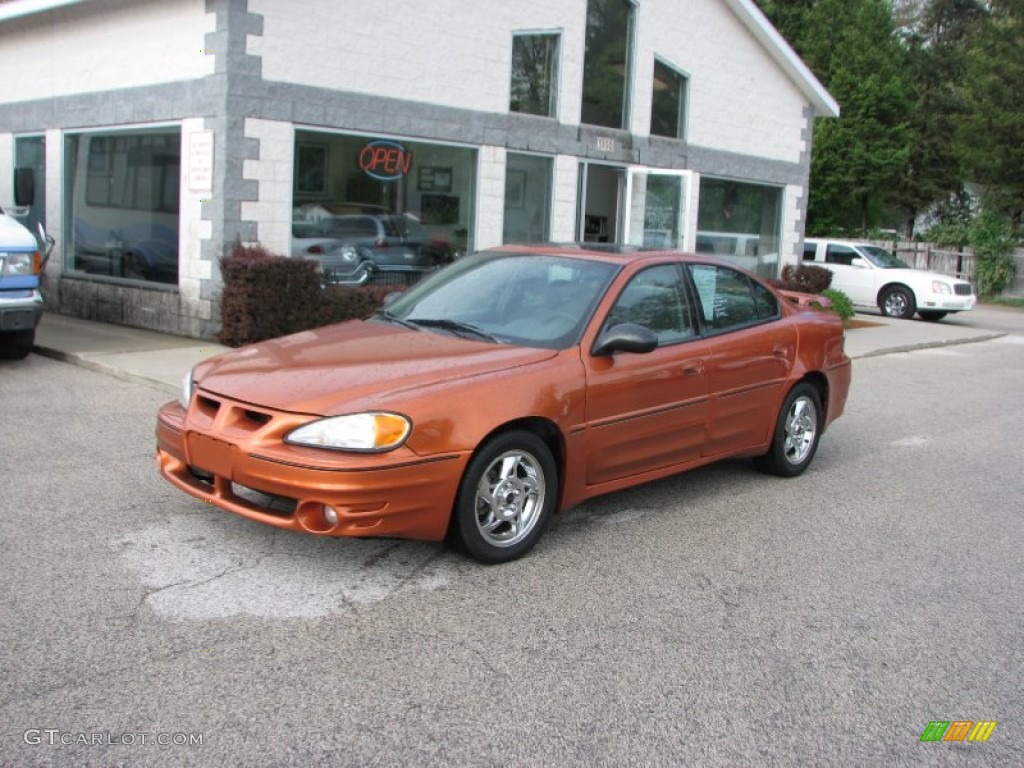 2004 Grand Am GT Sedan - Fusion Orange Metallic / Dark Pewter photo #1