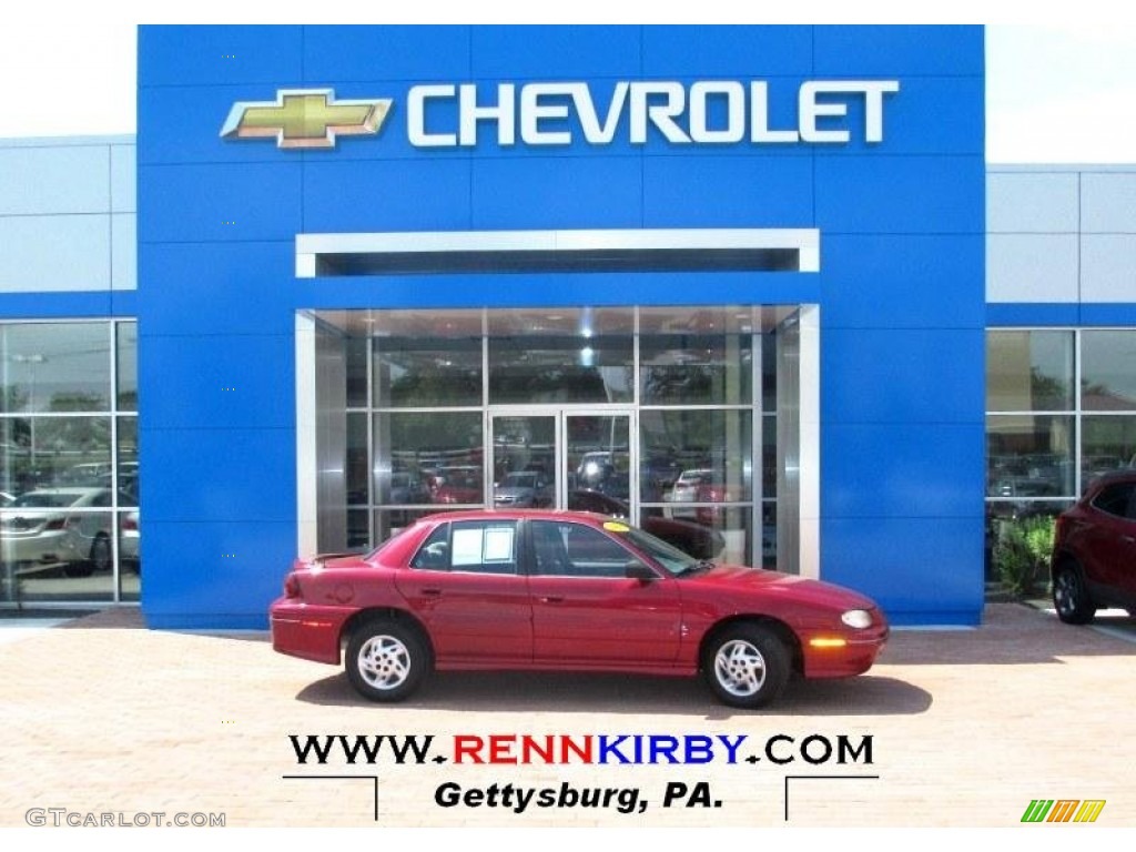 1998 Grand Am SE Sedan - Medium Red Metallic / Graphite photo #1