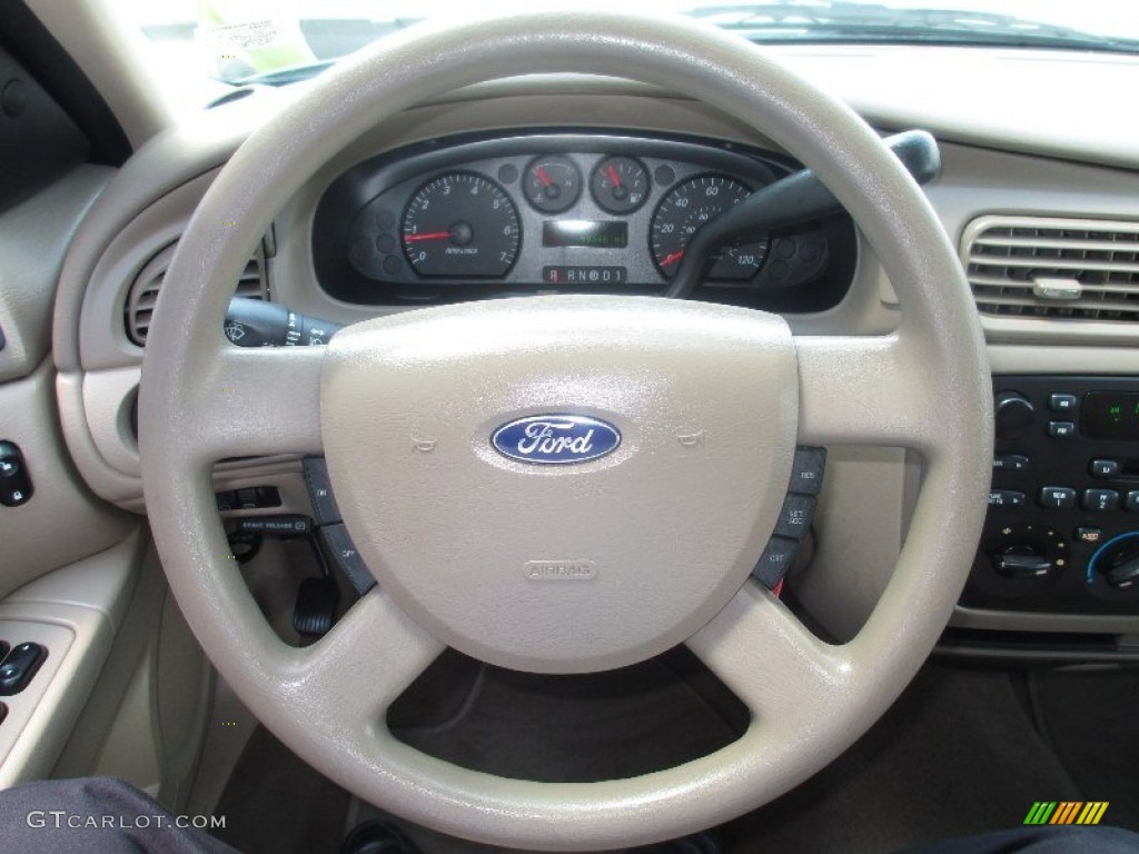 2005 Ford Taurus SE Wagon Medium/Dark Pebble Steering Wheel Photo #81651832