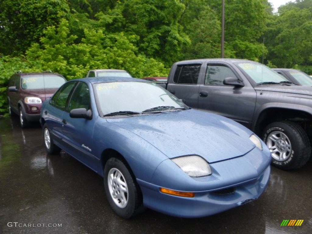 Bright Blue Aqua Metallic 1999 Pontiac Sunfire SE Sedan Exterior Photo #81997911