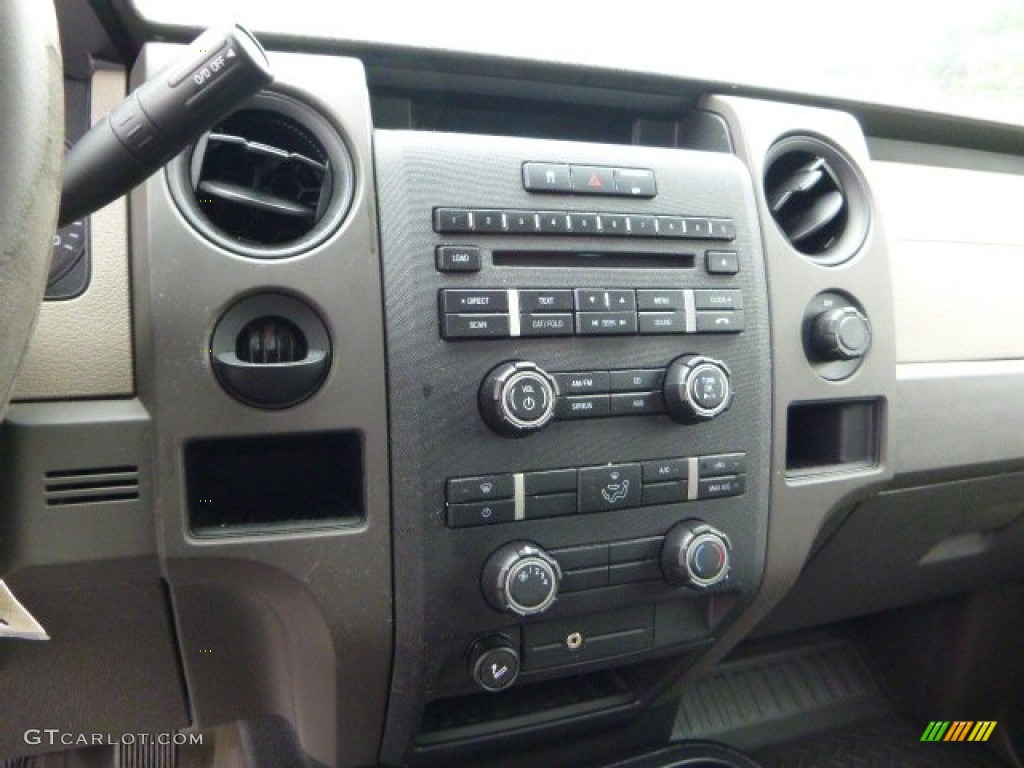 2010 F150 STX Regular Cab 4x4 - Tuxedo Black / Medium Stone photo #13