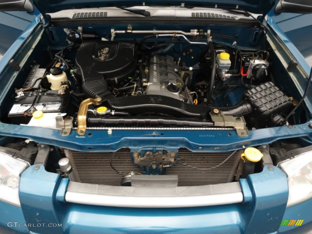 2004 Frontier XE King Cab - Electric Blue Metallic / Charcoal photo #9