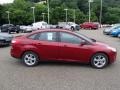 2013 Ruby Red Ford Focus SE Sedan  photo #1