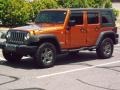 Mango Tango Pearl 2010 Jeep Wrangler Unlimited Mountain Edition 4x4