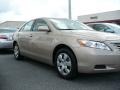 2009 Desert Sand Metallic Toyota Camry LE  photo #1