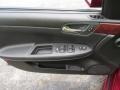 2009 Chevrolet Impala Ebony Interior Door Panel Photo