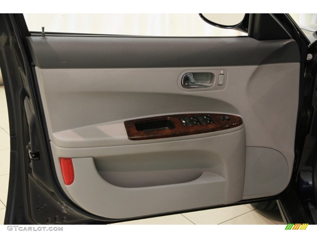 2007 Buick LaCrosse CX Gray Door Panel Photo #82936406