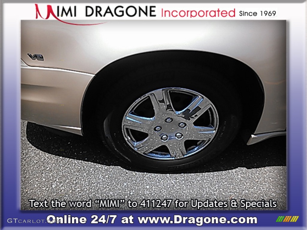 2005 Grand Am SE Sedan - Champagne Beige Metallic / Dark Taupe photo #4