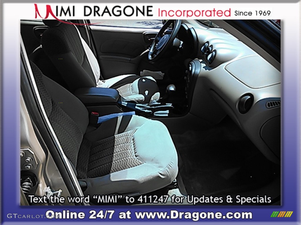 2005 Grand Am SE Sedan - Champagne Beige Metallic / Dark Taupe photo #13
