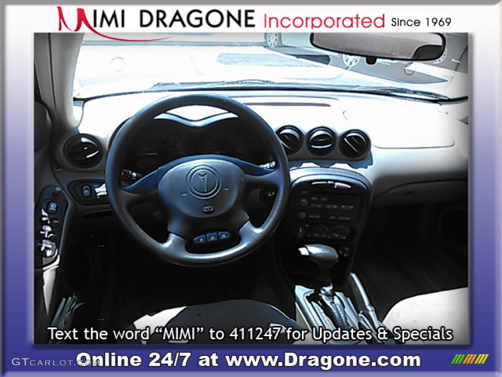 2005 Grand Am SE Sedan - Champagne Beige Metallic / Dark Taupe photo #17