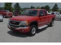 2005 Fire Red GMC Sierra 2500HD SLE Extended Cab 4x4  photo #61