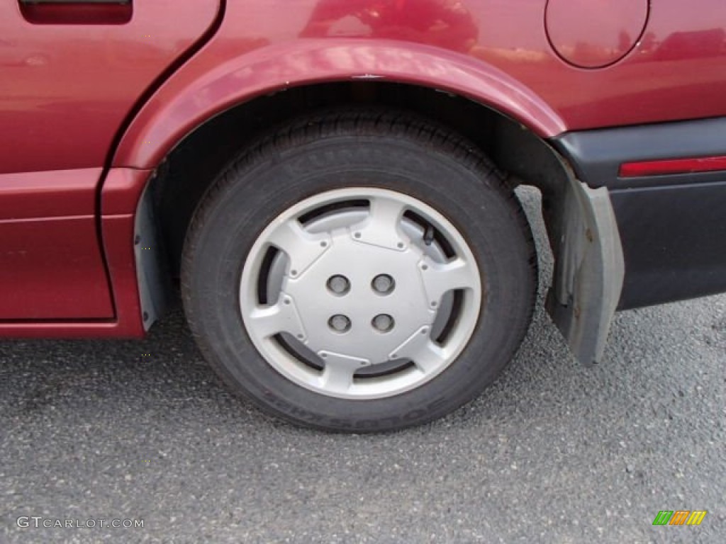 1993 Saturn S Series SL1 Sedan Wheel Photo #83516409