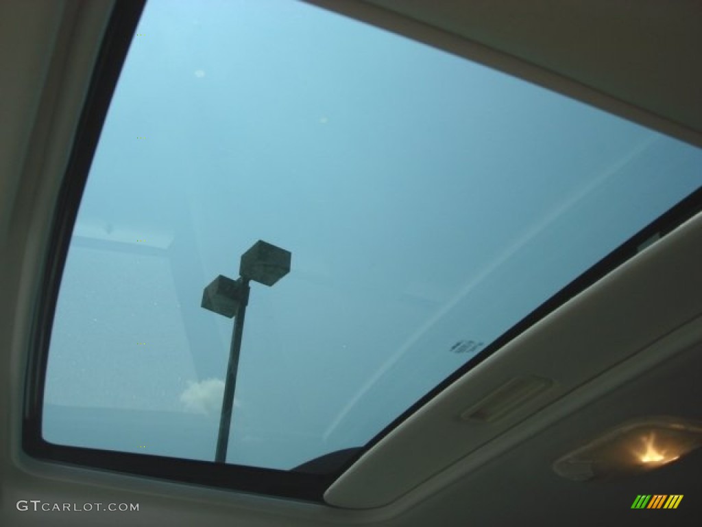 2010 Mariner V6 Premier 4WD - Sangria Red Metallic / Stone photo #15