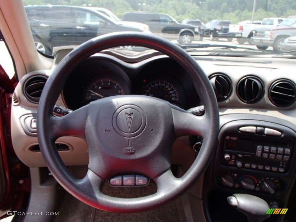 2001 Grand Am SE Coupe - Redfire Metallic / Dark Taupe photo #13