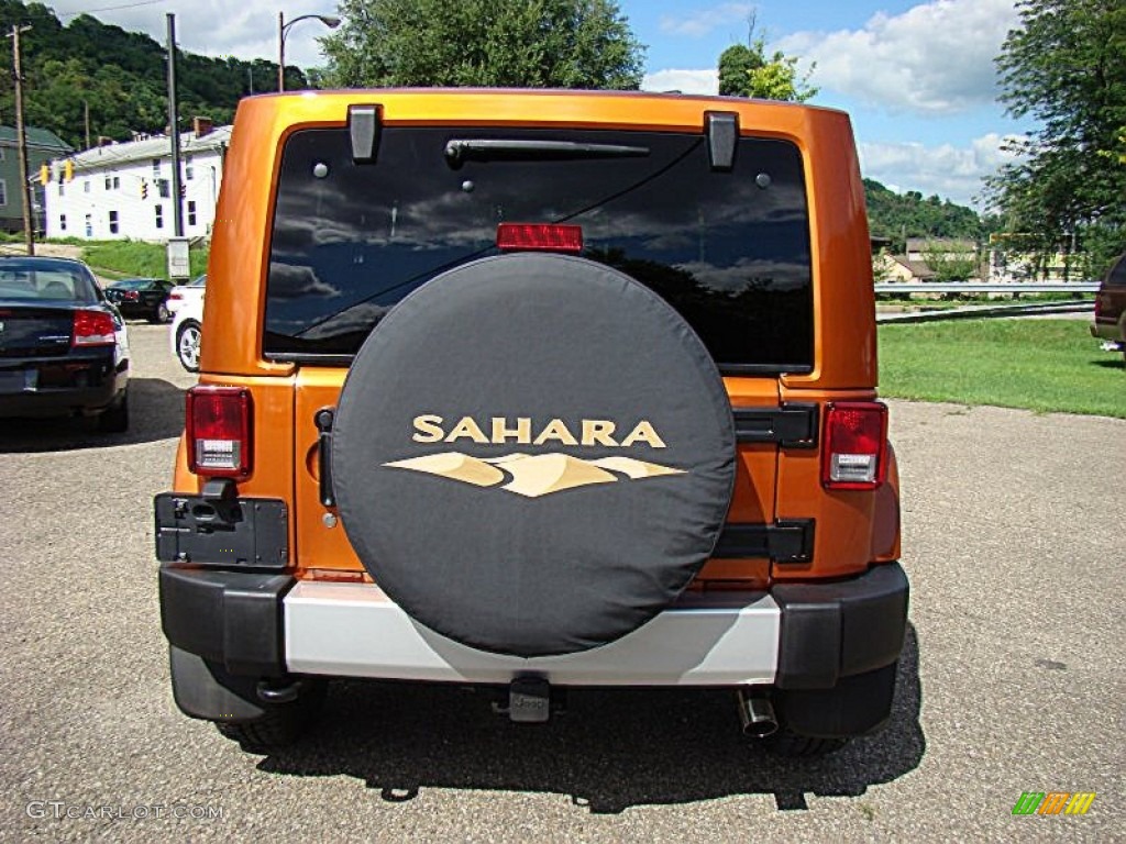2011 Wrangler Sahara 4x4 - Mango Tango Pearl / Black photo #7
