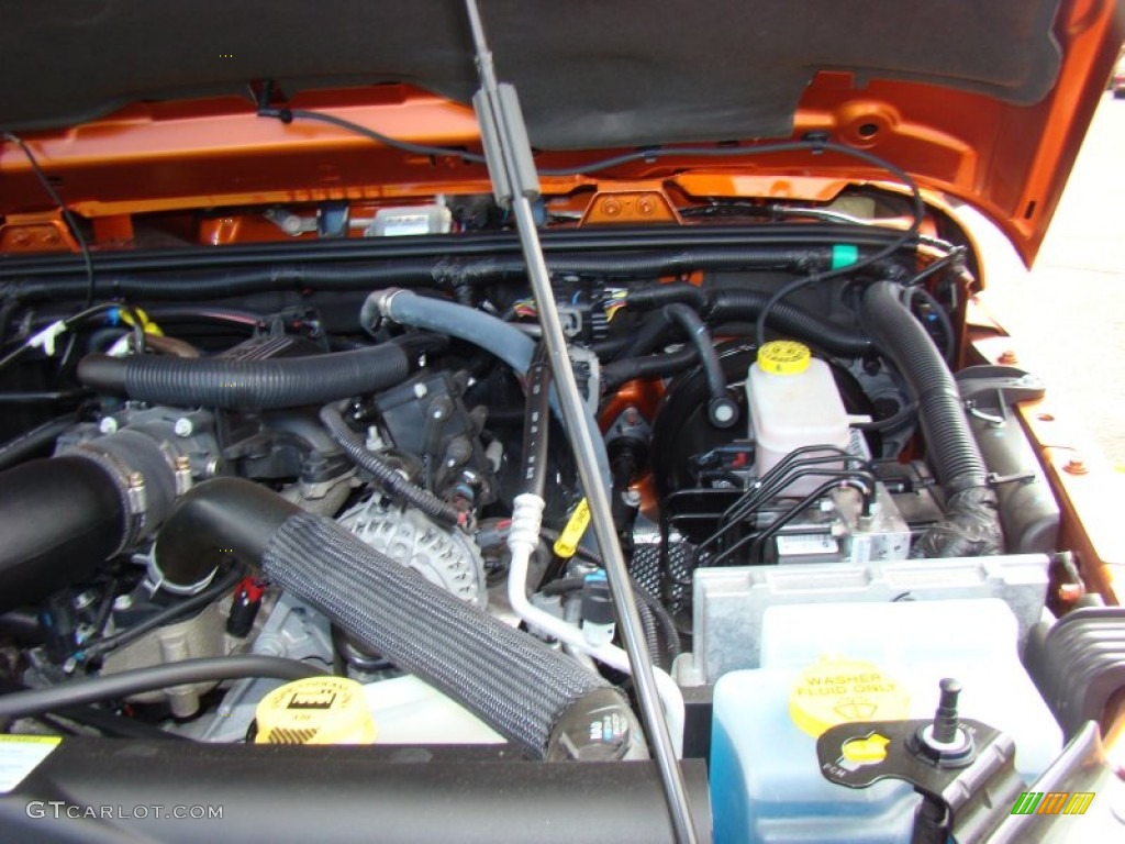 2011 Wrangler Sahara 4x4 - Mango Tango Pearl / Black photo #32