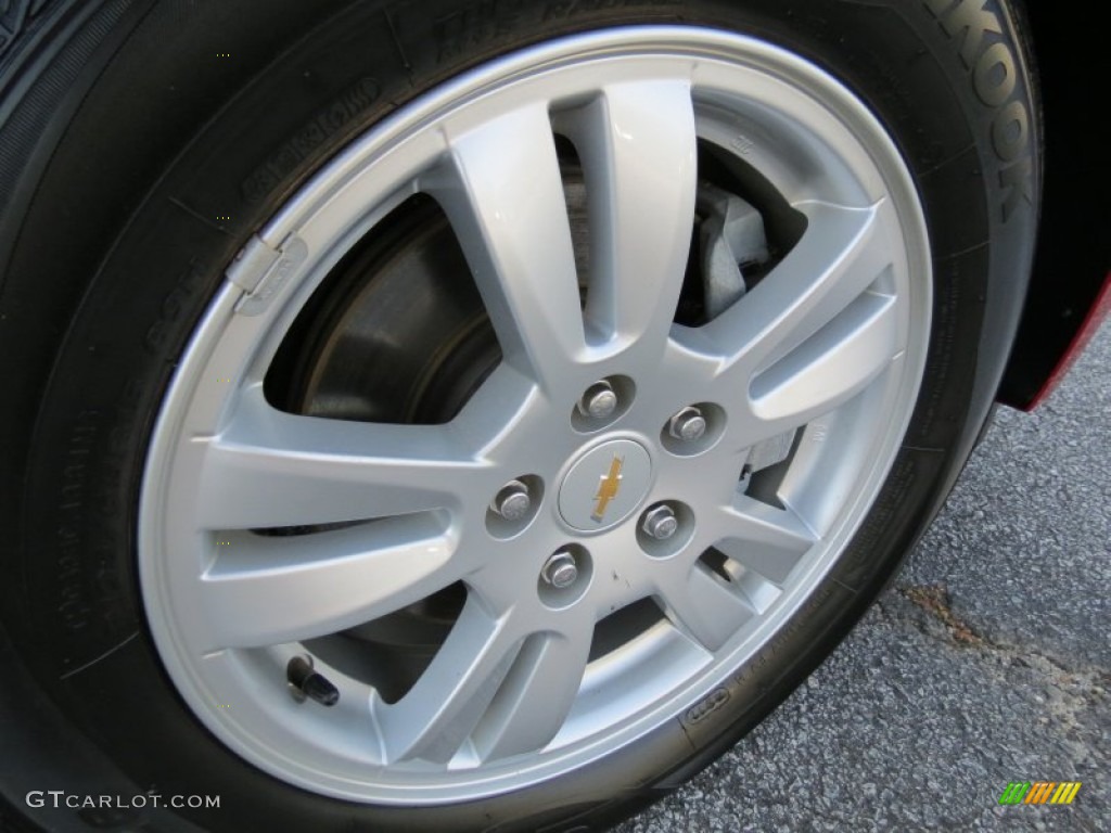 2012 Sonic LS Sedan - Crystal Red Tintcoat / Jet Black/Dark Titanium photo #9