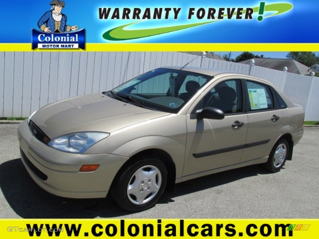 2002 Focus LX Sedan - Fort Knox Gold / Medium Graphite photo #1