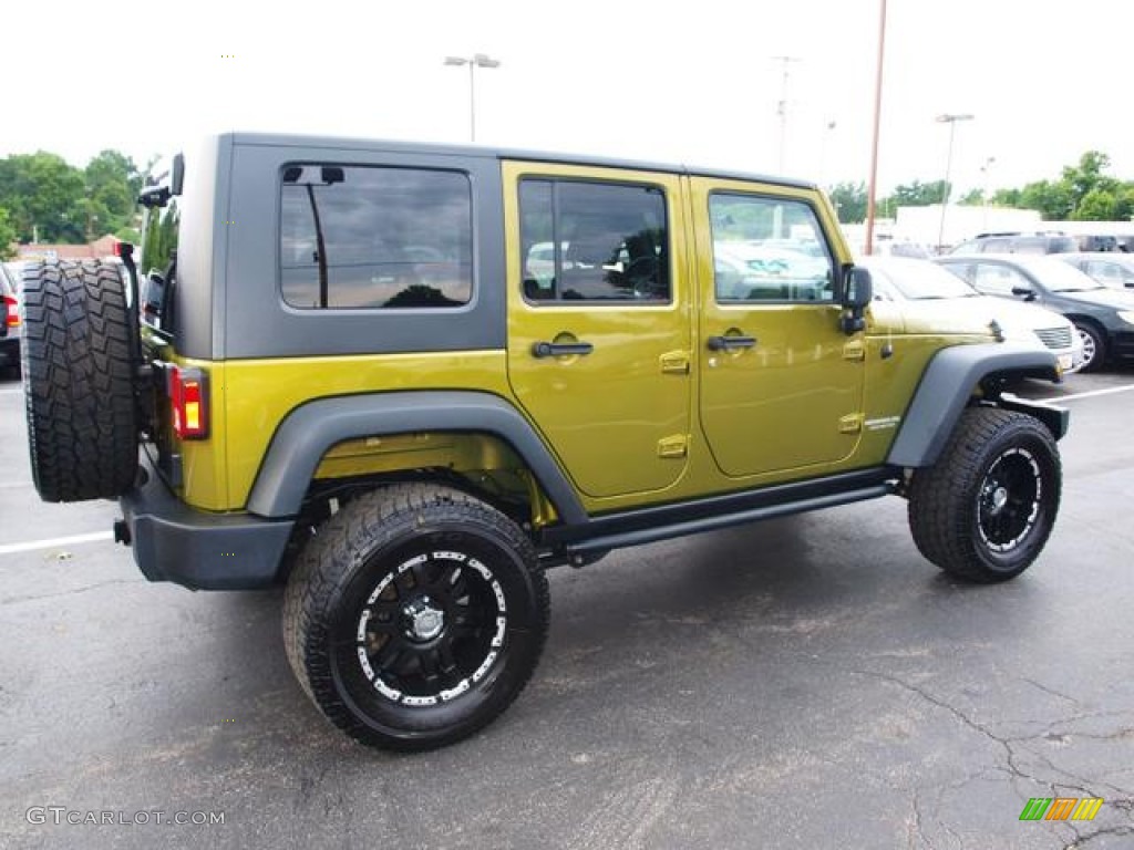 Rescue Green Metallic 2010 Jeep Wrangler Unlimited Rubicon 4x4 Exterior Photo #83949100