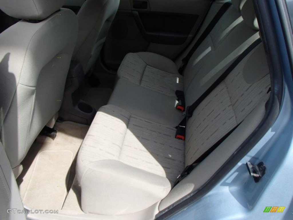 2009 Focus SE Sedan - Light Ice Blue Metallic / Medium Stone photo #12