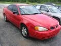 1999 Bright Red Pontiac Grand Am SE Sedan #84450113