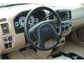 2004 Ford Escape Medium/Dark Pebble Interior Steering Wheel Photo