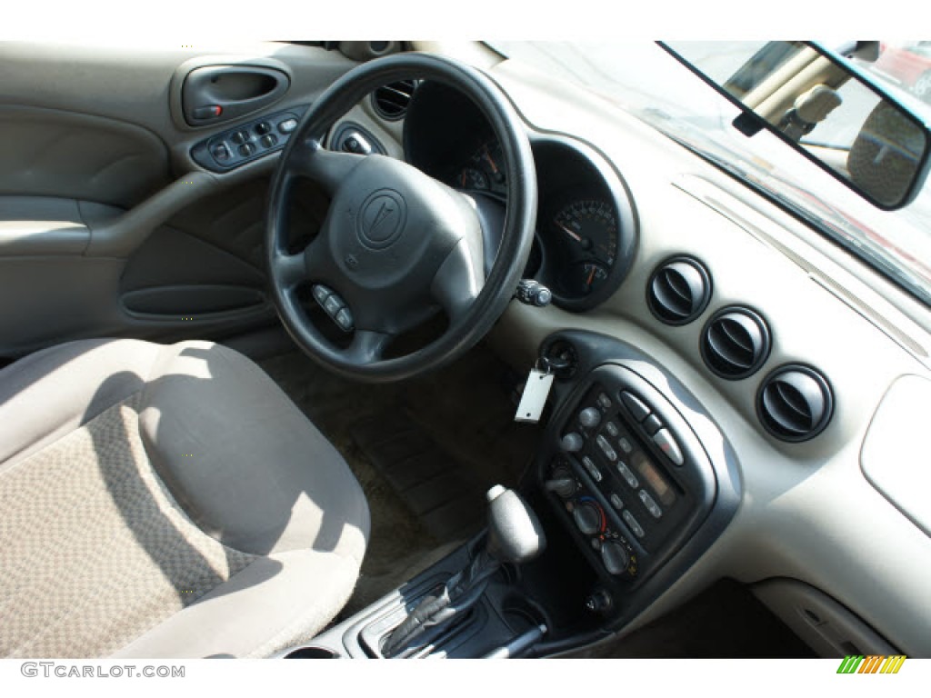 2003 Grand Am SE Sedan - Redfire Metallic / Dark Taupe photo #5