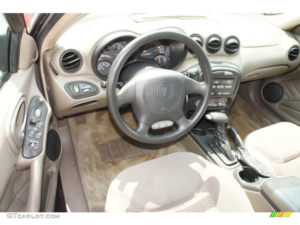 2003 Grand Am SE Sedan - Redfire Metallic / Dark Taupe photo #7