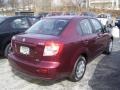 2009 Cherry Red Metallic Suzuki SX4 Sedan LE  photo #2