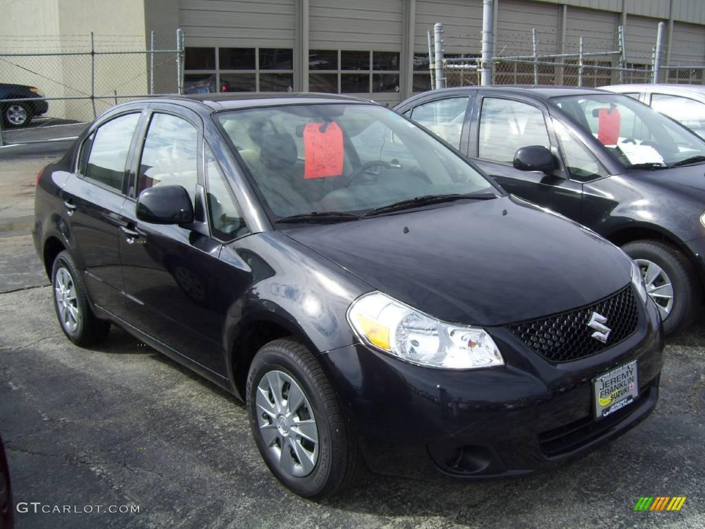 2009 SX4 Sedan LE - Black Pearl Metallic / Beige photo #1