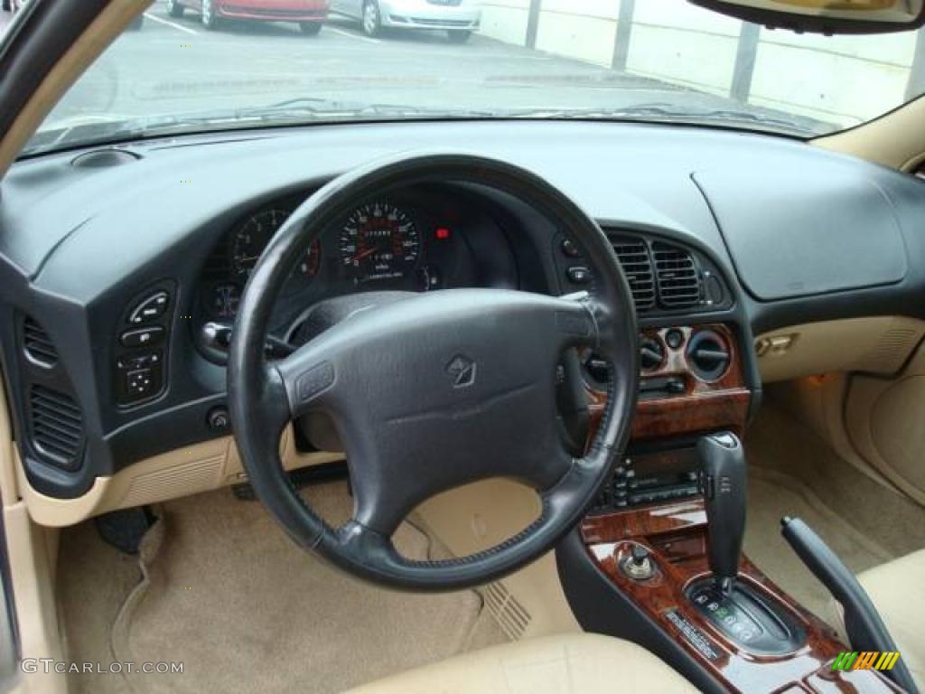 1998 Sebring LXi Coupe - Cafe Latte Metallic / Black/Tan photo #12