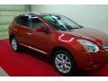 2011 Cayenne Red Nissan Rogue SV  photo #1