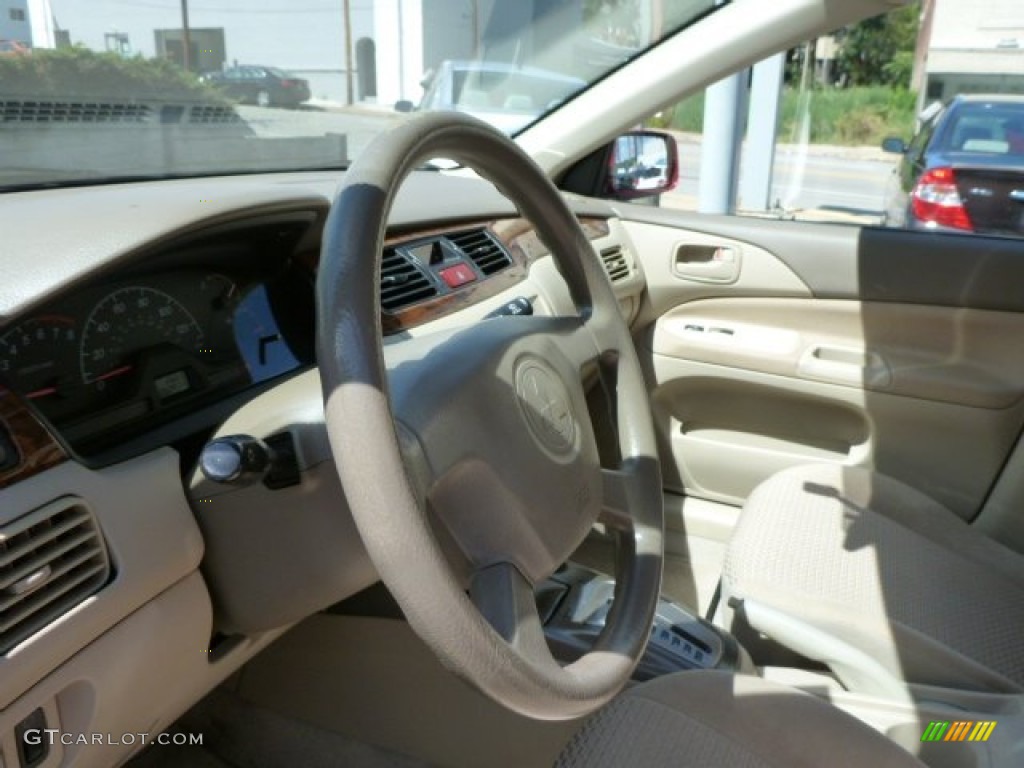 2002 Mitsubishi Lancer LS Tan Steering Wheel Photo #85447389