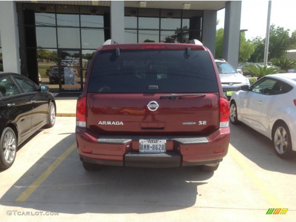 2010 Armada SE - Tuscan Sun Red Pearl / Charcoal photo #3