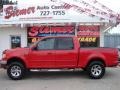 2001 Bright Red Ford F150 Lariat SuperCrew 4x4  photo #1