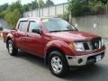2007 Red Brawn Nissan Frontier LE Crew Cab 4x4  photo #1