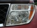 2007 Red Brawn Nissan Frontier LE Crew Cab 4x4  photo #26