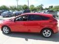 2014 Race Red Ford Focus SE Hatchback  photo #2