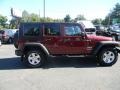 2010 Flame Red Jeep Wrangler Unlimited Mountain Edition 4x4  photo #7