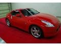 2011 Solid Red Nissan 370Z Touring Coupe  photo #1