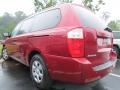 2010 Claret Red Kia Sedona LX  photo #2